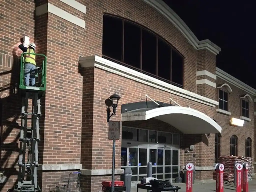 electrician working in lift on building exterior